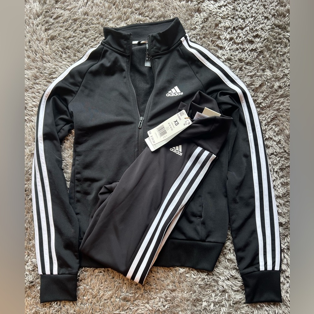 Adidas Pants and jacket suit. Never been worn.